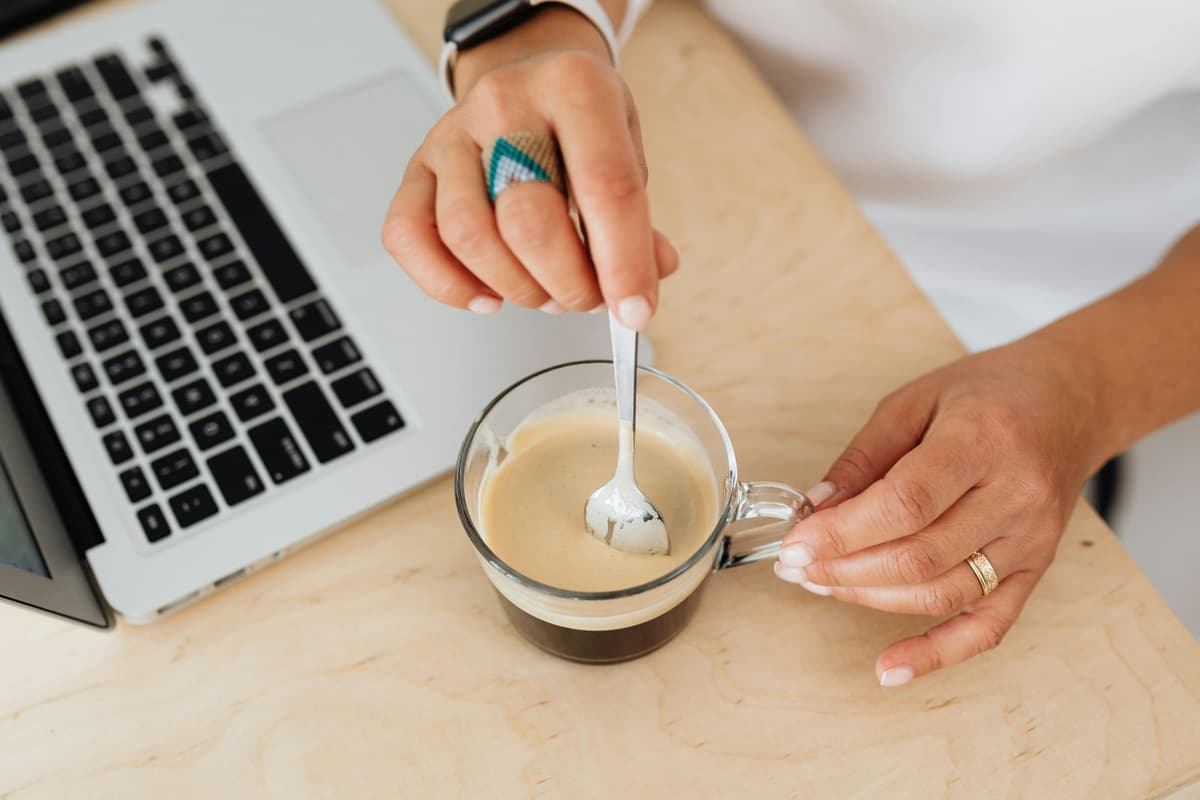 Person holding a coffee mug, representing blog inspiration and creativity