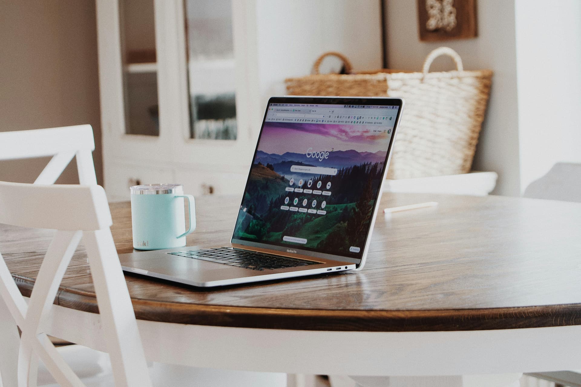 Macbook on a wooden table, representing SEO work and digital marketing