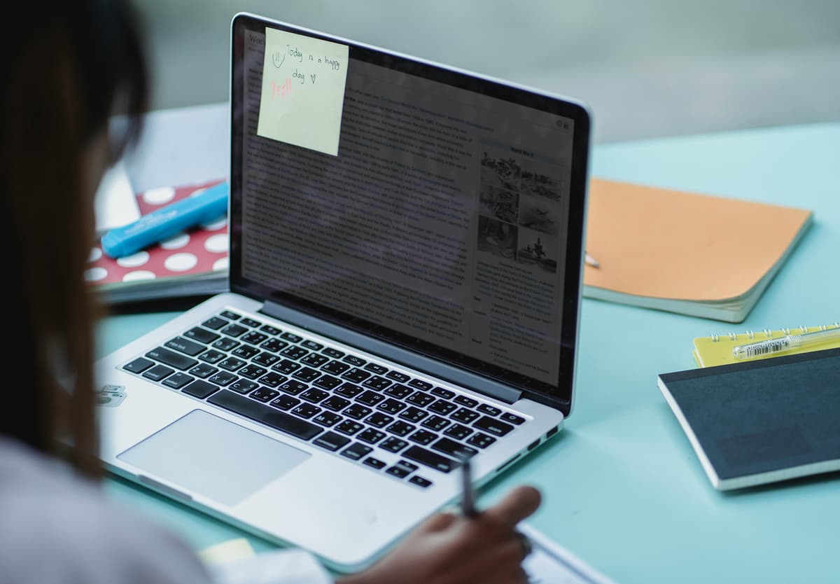 Multiethnic students studying SEO on a laptop, representing the decision to pursue SEO certification