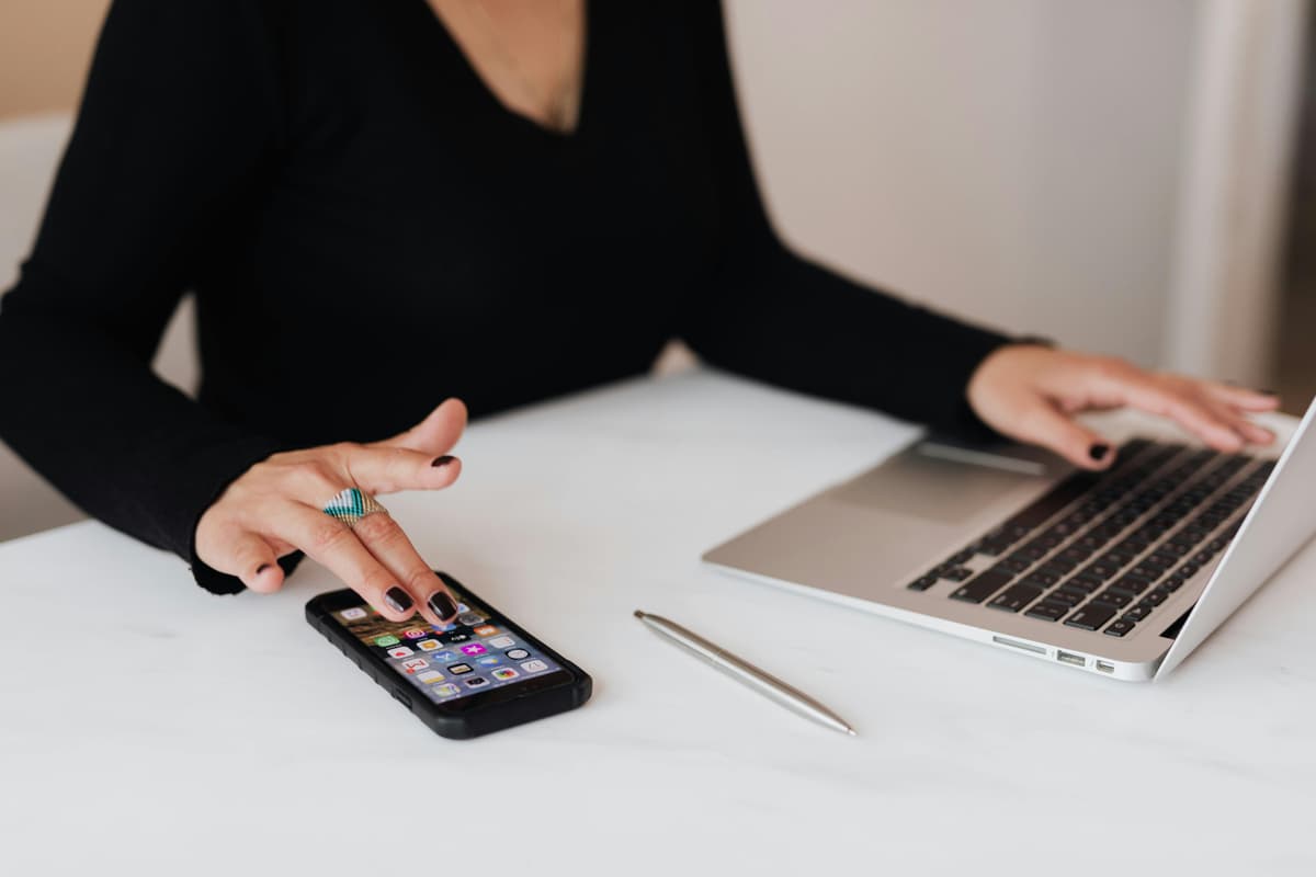 Person multitasking in an office, representing the various aspects of WooCommerce SEO services