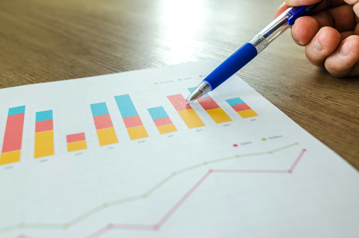 Person pointing at a graph, representing SEO performance comparison