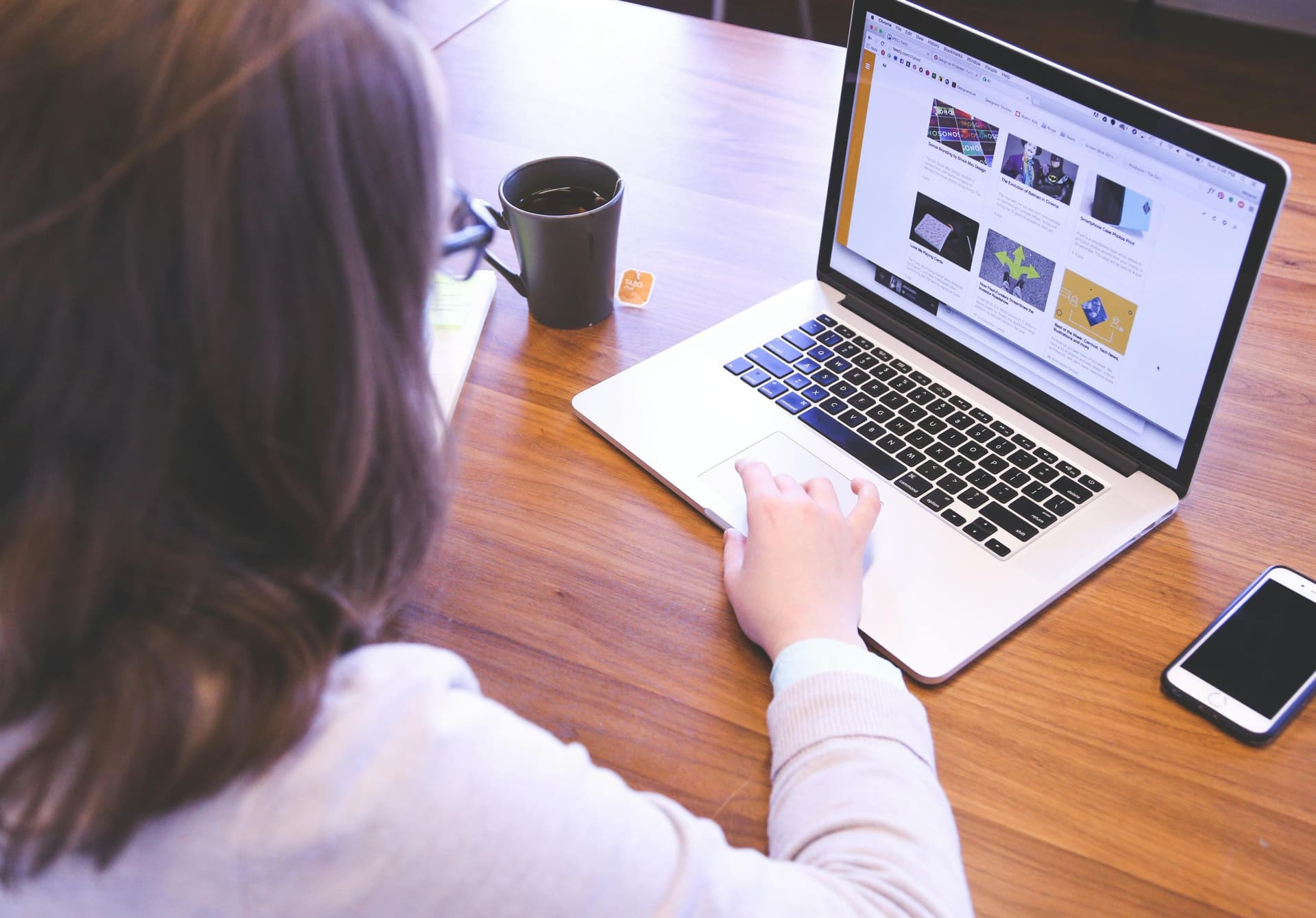 Woman swiping on a touchpad, representing digital engagement and subscription