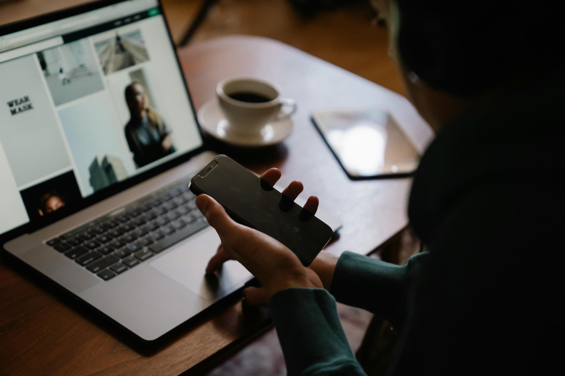 Person multitasking at workplace, representing the complexity of SEO